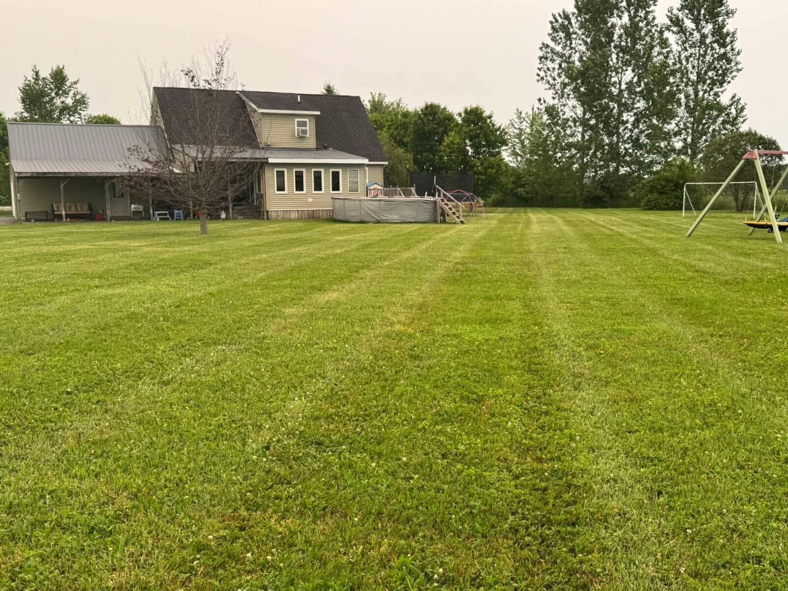Backyard Lawn Maintenance by Greenscapes Property Management