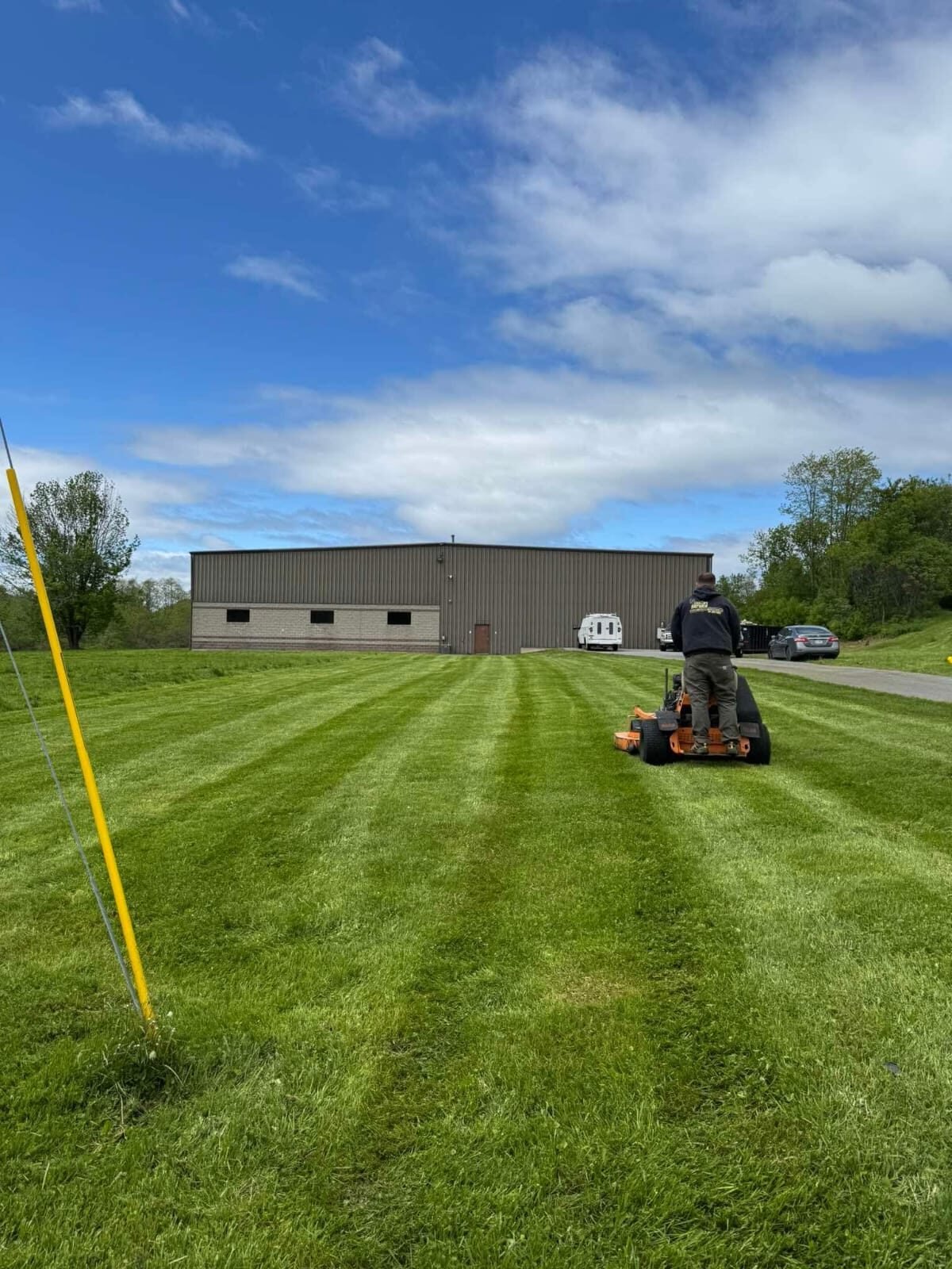 Commercial Mowing in Action by Greenscapes Property Management